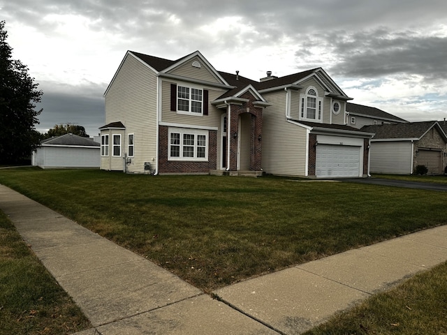 view of front facade featuring a front lawn and a garage