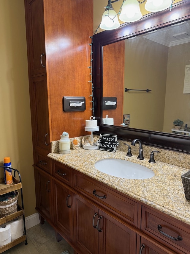 bathroom featuring vanity and crown molding