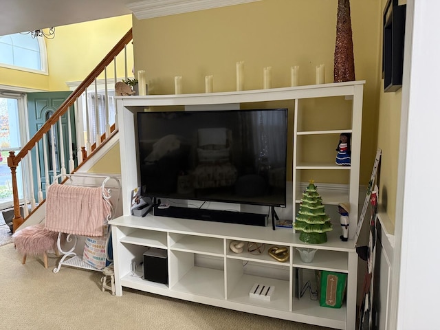 interior details with carpet flooring and crown molding