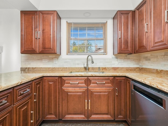 kitchen with tasteful backsplash, stainless steel dishwasher, sink, and light stone counters