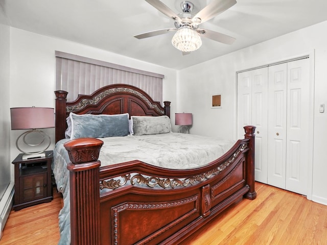 bedroom featuring ceiling fan, a closet, and light hardwood / wood-style flooring