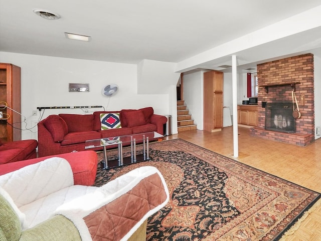 living room with parquet flooring and a fireplace