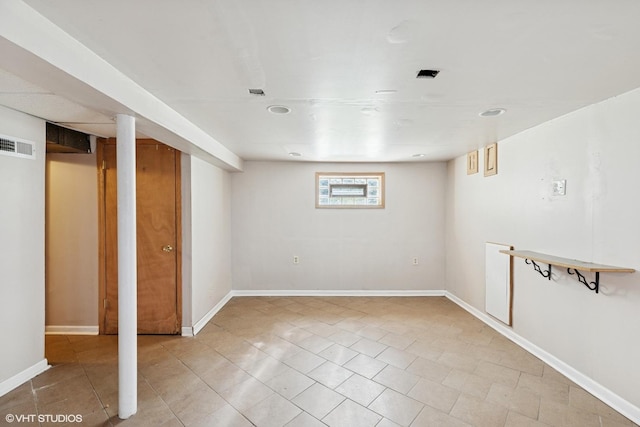 1242 E 98th St, Chicago, IL 60628 - below grade area with light tile patterned flooring and baseboards