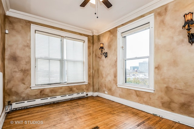 empty room with hardwood / wood-style floors, ceiling fan, a baseboard radiator, and ornamental molding