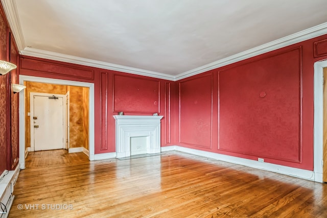 unfurnished living room with light hardwood / wood-style floors and crown molding