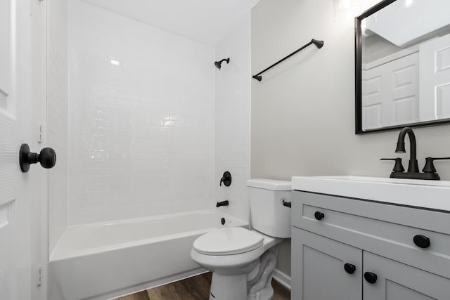 full bathroom with toilet, bathtub / shower combination, vanity, and hardwood / wood-style flooring