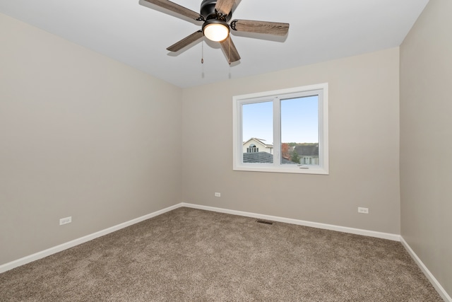 empty room with ceiling fan and carpet flooring