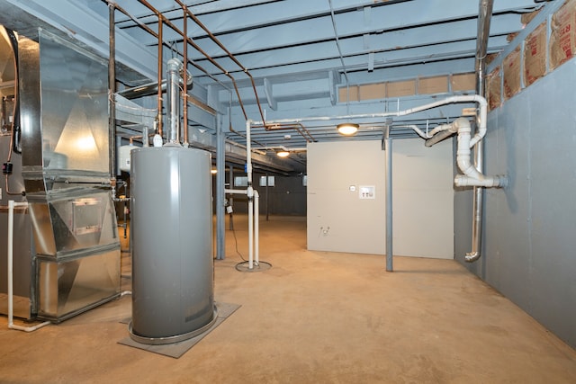 basement with water heater and heating unit