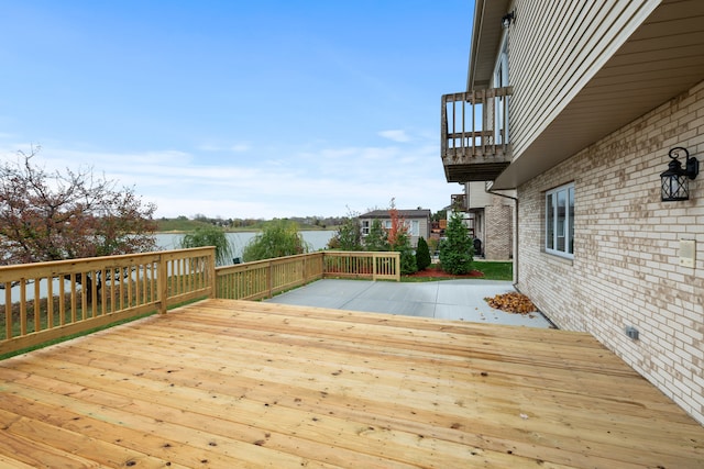 wooden terrace with a water view