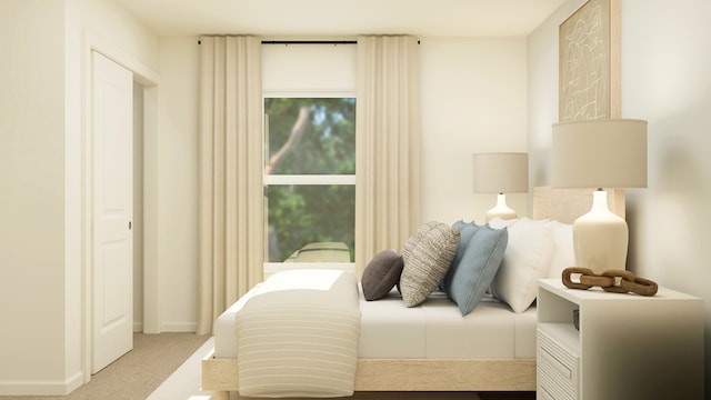 bedroom featuring light carpet