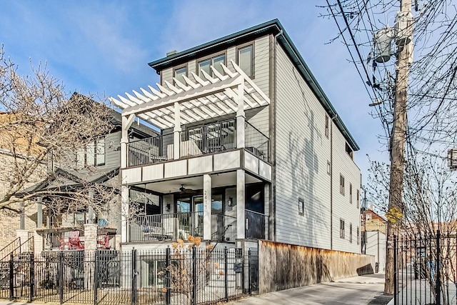 view of front of property featuring a balcony