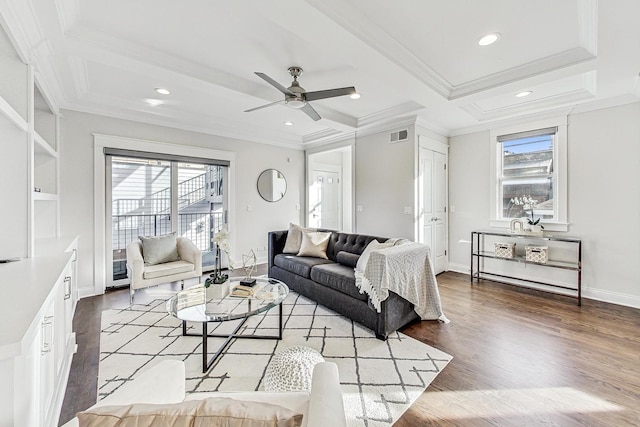 living room with coffered ceiling, ornamental molding, beamed ceiling, ceiling fan, and hardwood / wood-style floors