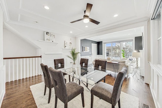 dining room featuring crown molding and wood-type flooring