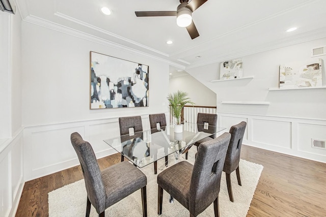 dining area featuring ornamental molding, hardwood / wood-style floors, and ceiling fan