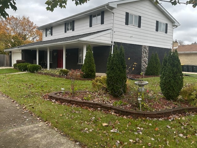 view of front of property with a porch and a front yard