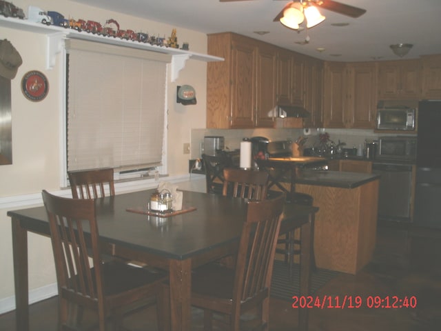 dining space featuring ceiling fan