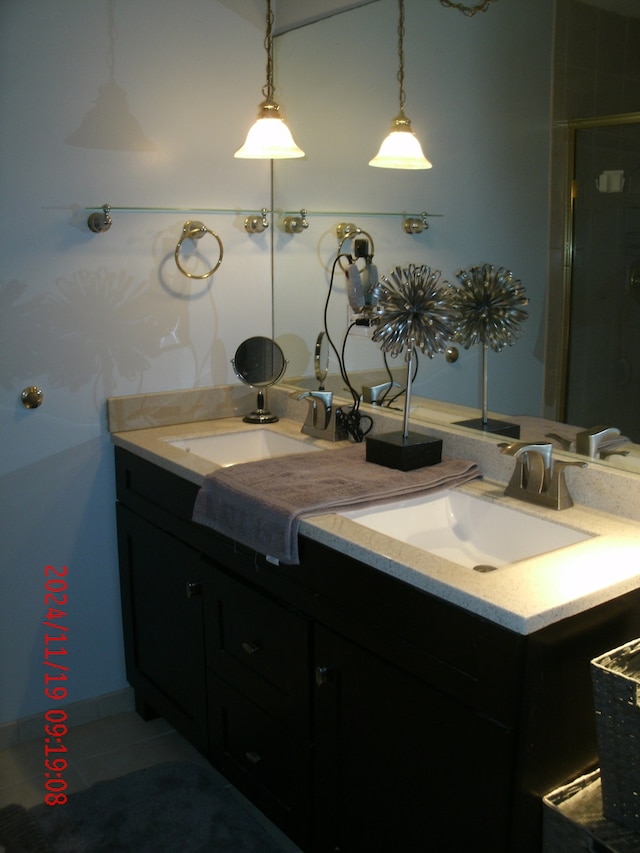 bathroom with tile patterned flooring and vanity