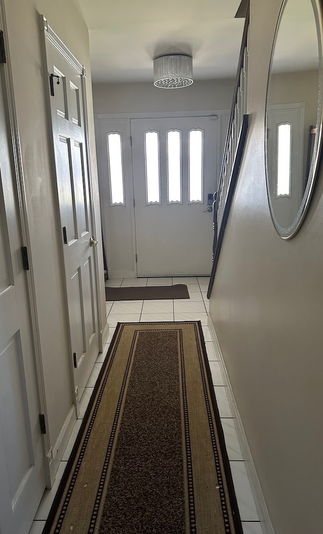 entryway with light tile patterned floors