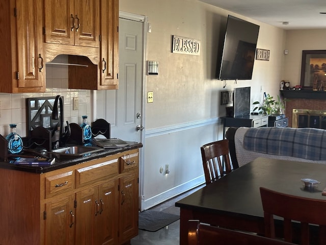 kitchen featuring backsplash and sink