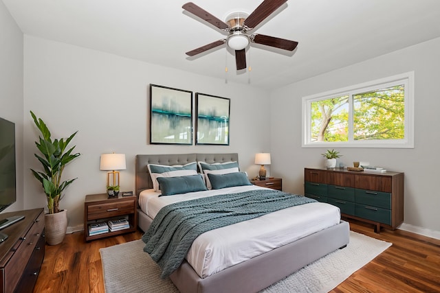 bedroom featuring ceiling fan and dark wood-type flooring