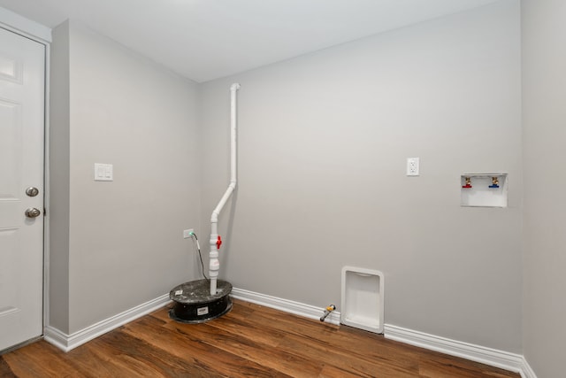 clothes washing area with hardwood / wood-style floors, hookup for a gas dryer, and hookup for a washing machine