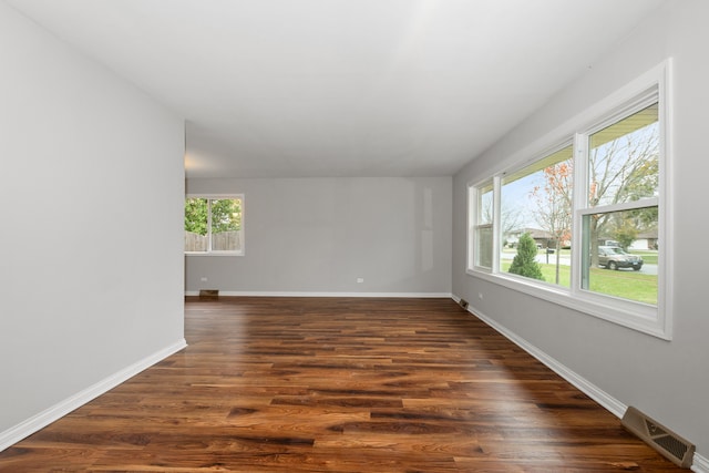 spare room featuring dark hardwood / wood-style floors