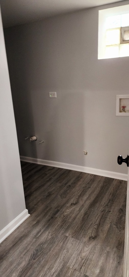 washroom with washer hookup and dark hardwood / wood-style floors