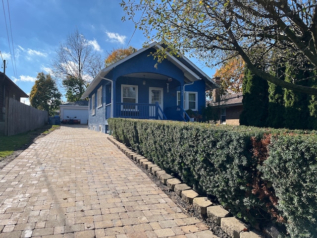 bungalow with a garage and a porch