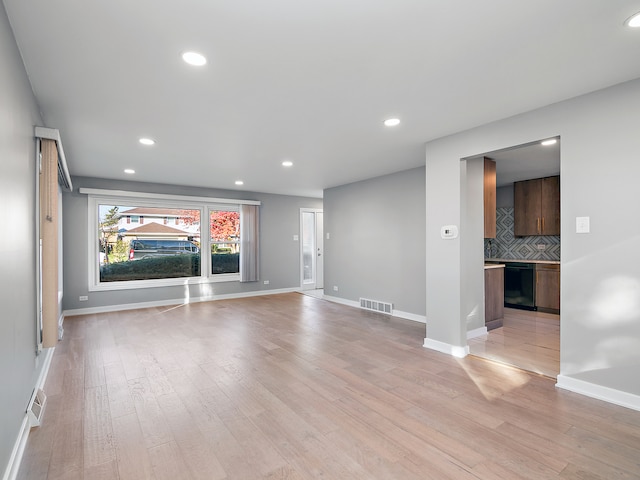 unfurnished living room featuring light wood-type flooring