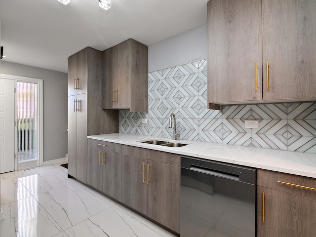 kitchen with sink, light stone counters, dishwasher, and tasteful backsplash