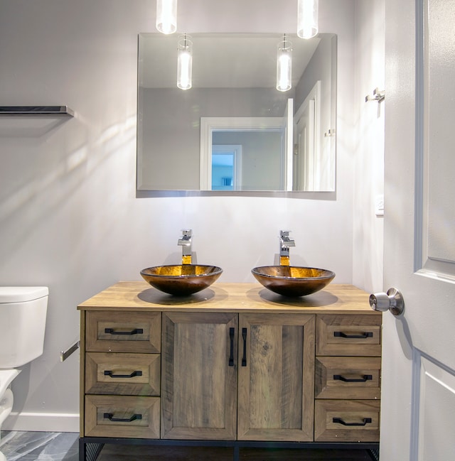 bathroom with vanity and toilet