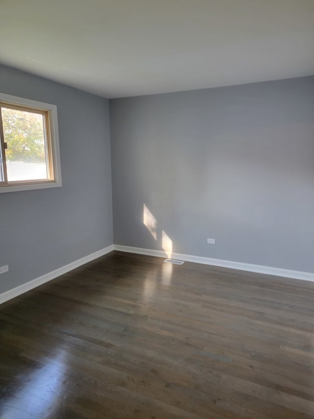 empty room featuring dark hardwood / wood-style floors