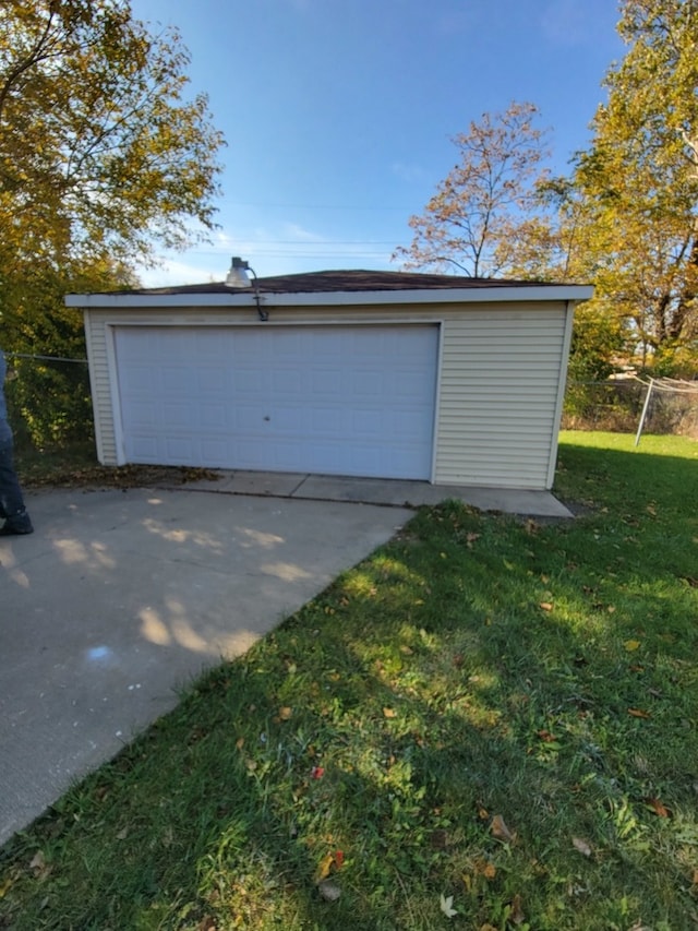 garage featuring a lawn