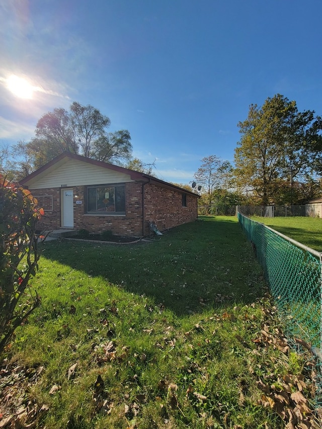 view of home's exterior featuring a yard