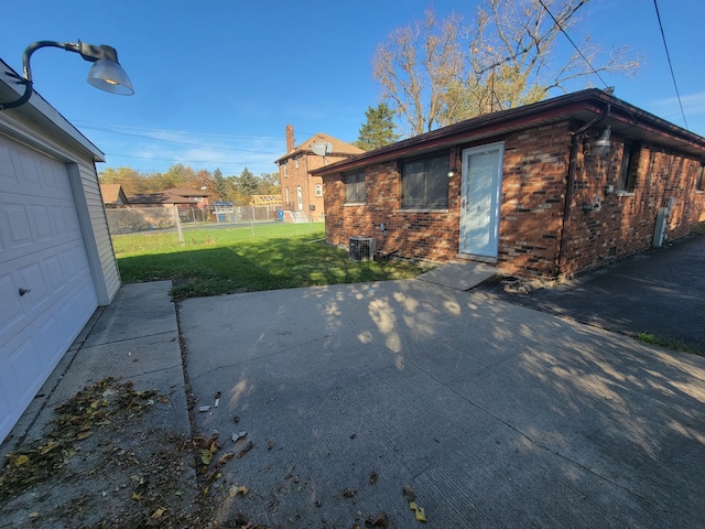 exterior space featuring a lawn and cooling unit