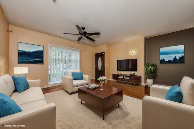 living room with ceiling fan and light hardwood / wood-style floors