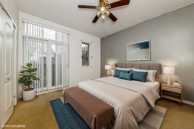 bedroom featuring ceiling fan, dark colored carpet, and a closet