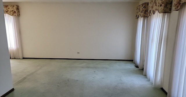 spare room with light carpet