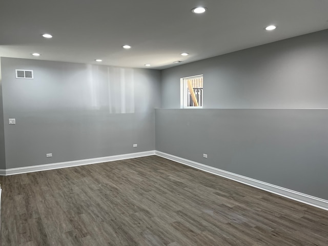 unfurnished room featuring dark hardwood / wood-style floors