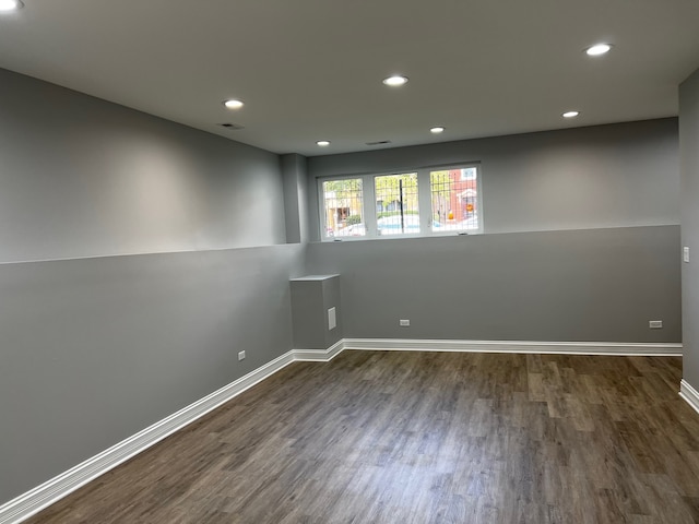 empty room featuring dark hardwood / wood-style flooring