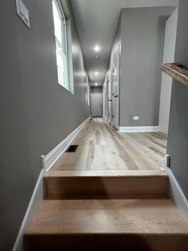 staircase featuring hardwood / wood-style floors