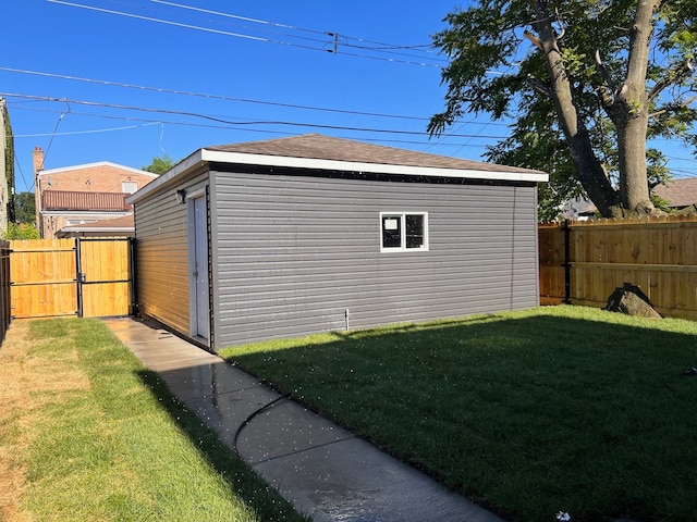 view of outdoor structure featuring a lawn