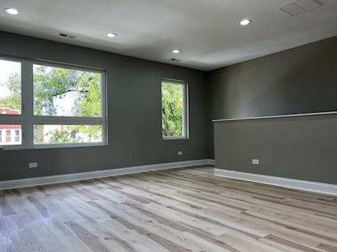 unfurnished room with light hardwood / wood-style flooring