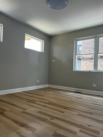 unfurnished room featuring light hardwood / wood-style flooring