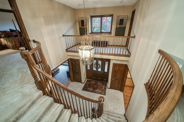 interior space with carpet flooring and a notable chandelier