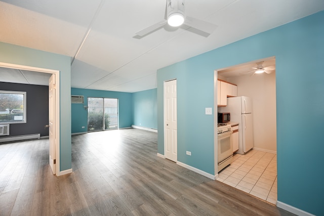 unfurnished living room featuring a baseboard radiator, light hardwood / wood-style flooring, and ceiling fan