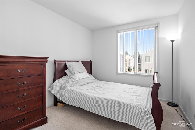 bedroom with light colored carpet