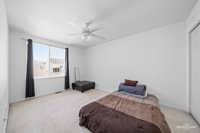 carpeted bedroom featuring ceiling fan