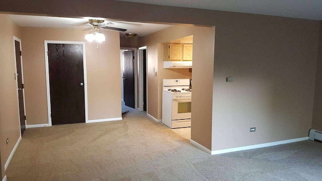 3680 W 119th St Unit 102B, Alsip, IL 60803 - kitchen featuring white gas stove, under cabinet range hood, light colored carpet, and a ceiling fan