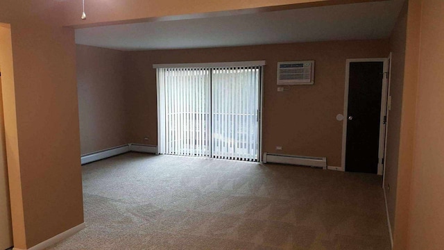 carpeted spare room with a baseboard heating unit and a wall mounted air conditioner